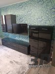 Меблева стінка, чорного кольору, довжина — 3 м (частина кріпиться на стіну), б/в